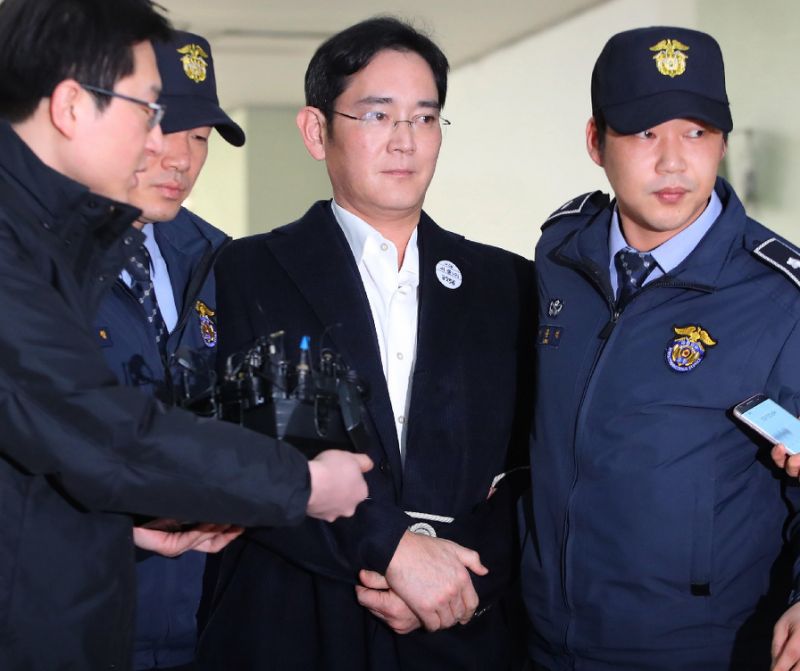 arrestedsamsungheirappearshandcuffedforquestioning